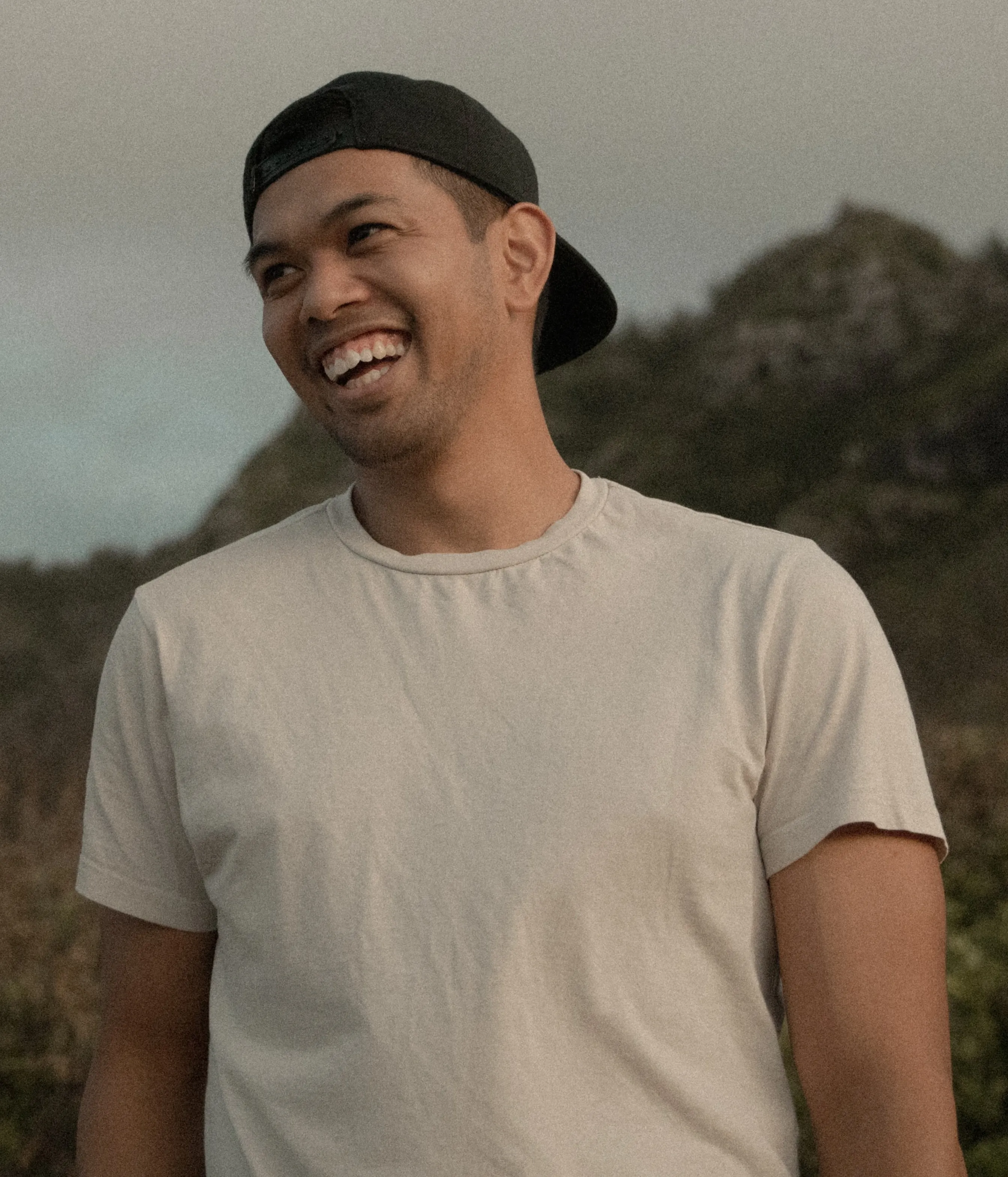 Christian smiling away from the camera